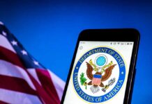 U.S. Department of State emblem on smartphone screen.