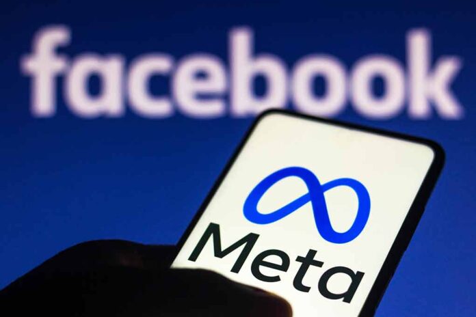 Smartphone displaying Meta logo with Facebook in background.