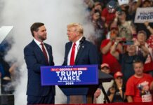 Two men at a political rally stage event