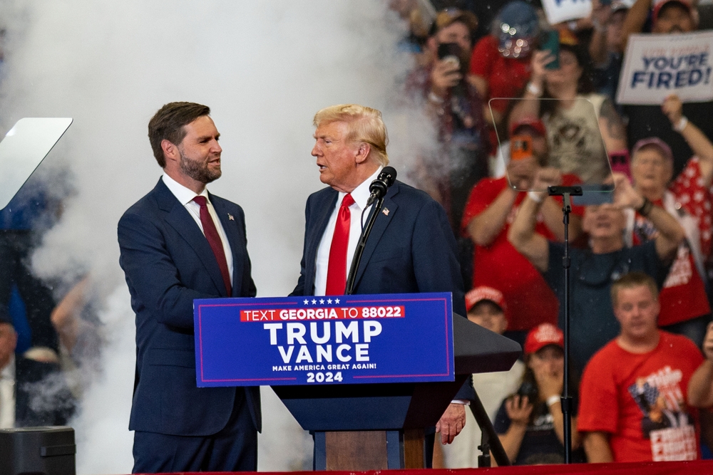 Two men at a political rally stage event