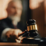 Judge Halts UNPRECEDENTED Pentagon Punishment Scheme… Judge striking gavel in courtroom.