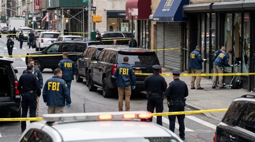shutterstock_2755604263.jpg FBI agents and police officers at a crime scene with police tape