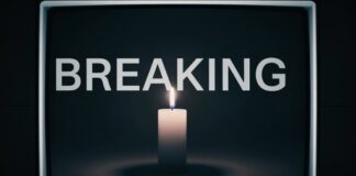 A candle illuminated against a dark background with the word 'BREAKING' displayed above it