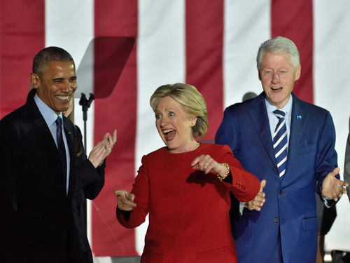 shutterstock_513636580 (1).jpg Barack Obama, Hillary Clinton, Bill Clinton at an event.