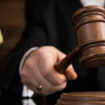 Gavel being struck on a sound block.