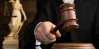Gavel being struck on a sound block.
