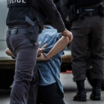 Mexican Senator ARRESTED – Cartel Conspiracy EXPOSED! Police officer arresting and handcuffing a person.