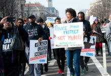 BLM Cash Trail Sparks Federal Heat… Protesters holding signs, including Police Should Protect Not Murder.