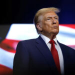 FBI CONSPIRACY Targets Trump—430 Republicans Hunted… donald trump in suit with red tie American flag backdrop
