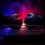 Two boxing gloves positioned in a ring with dramatic lighting and smoke