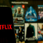 Davidson’s SICK Joke — His Own Tragedy Makes It WORSE… Netflix app open on phone; Hollywood movies in background.