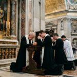 Vatican SNUBS Rubio After Marathon Secret Meeting… Clergy members kneeling in prayer inside a grand cathedral