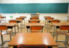 Bible Verse Backlash — School District Backs Off Empty classroom with wooden desks and chalkboard.