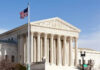 Supreme Court Nukes Marijuana Gun Ban United States Supreme Court building with American flag.