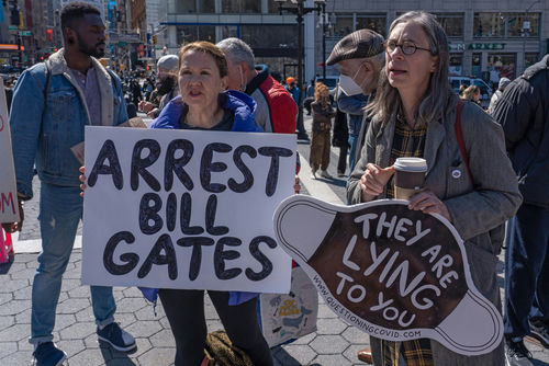 shutterstock1940030077-1jpg Protesters holding signs at an outdoor demonstration