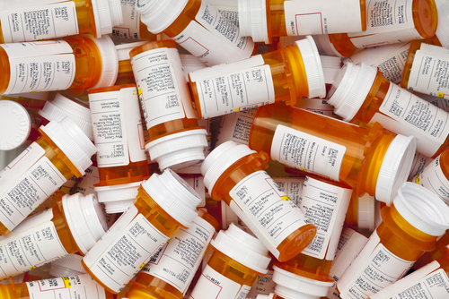 Dozens,Of,Prescription,Medicine,Bottles,In,A,Jumble.,This,Collection A pile of prescription medication bottles with labels