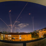 Israel Snatches Iconic Fortress — Hezbollah STUNNED… Night sky with missile defense system intercepting rockets above city.