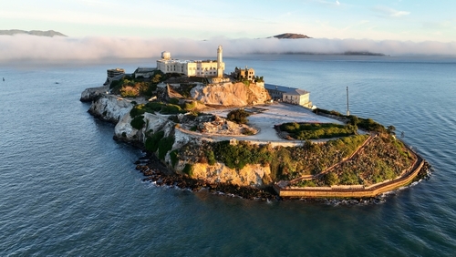 Alcatraz,Island,At,San,Francisco,In,California,United,States.,Nature Aerial view of Alcatraz Island surrounded by water and fog