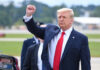 Trump Critic Flips — Over Hostages A political figure raising a fist in a gesture of confidence during an outdoor event