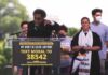 Socialism Alarm Hits Virginia Speaker at outdoor rally gestures from a podium
