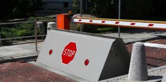Rising road blocker with stop sign at a security checkpoint
