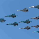 Mystery Drone BREACHES NATO Border A formation of military jet fighters flying in a clear blue sky