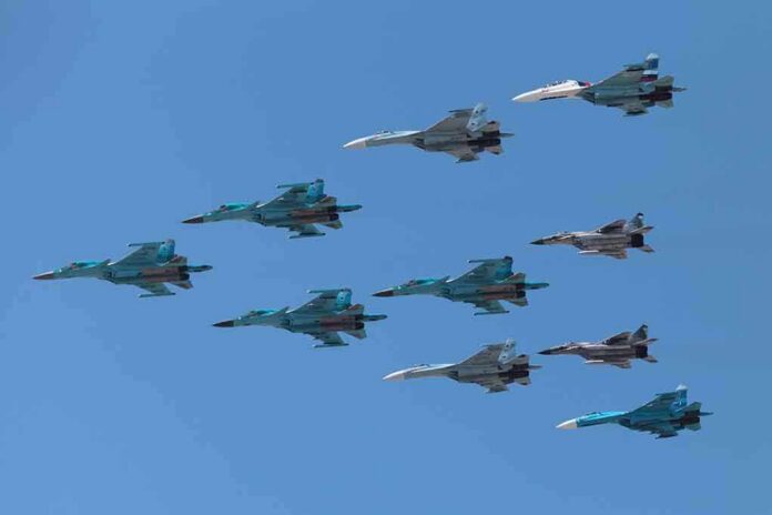 shutterstock_141377446 A formation of military jet fighters flying in a clear blue sky