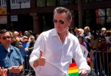 Mark Cuban Torches California’s New Billionaire Tax Push Man in white shirt giving thumbs up at a pride parade
