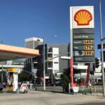 Oil Companies Profiting While Drivers Pay the Price Shell gas station with price sign on a sunny day