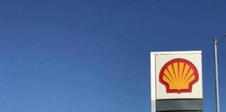 Shell gas station with price sign on a sunny day