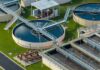Wastewater treatment plant with circular clarifiers and aeration tanks