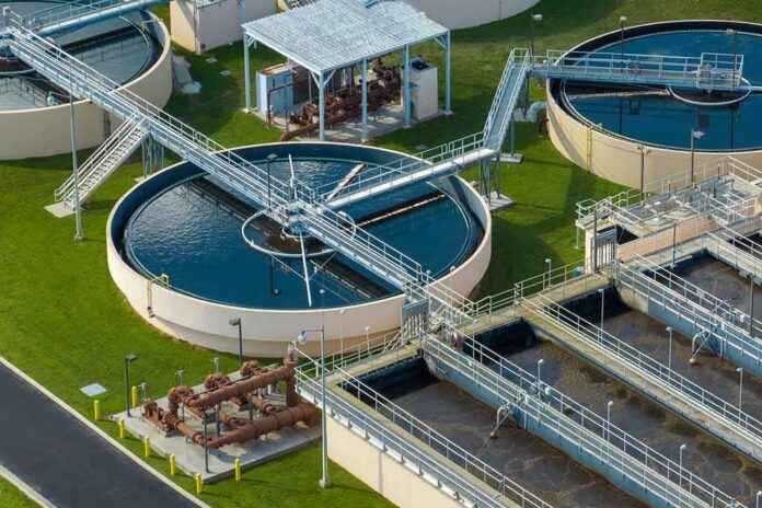 shutterstock_2291599451 Wastewater treatment plant with circular clarifiers and aeration tanks