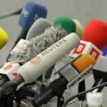 Iran Declares THESE News Outlets ‘Military Targets’ A collection of various microphones arranged for a press conference