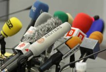 Iran Declares THESE News Outlets ‘Military Targets’ A collection of various microphones arranged for a press conference