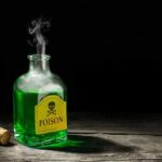 How Bullfrogs Could Help Save Many Lives Glass bottle of green liquid labeled poison on wooden surface