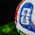 All Titans, No Underdogs Close-up of a FIFA-branded soccer ball on grass