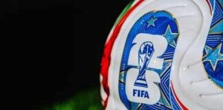 Close-up of a FIFA-branded soccer ball on grass