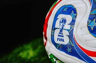 Close-up of a FIFA-branded soccer ball on grass