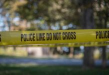 Intuitive Healer Makes Chilling Murder Admission yellow police tape cordoning off an outdoor area