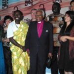 Canada’s Freedom Alarm — What’s Breaking? Desmond Tutu and Larry Burrows pose with a group at an awards event