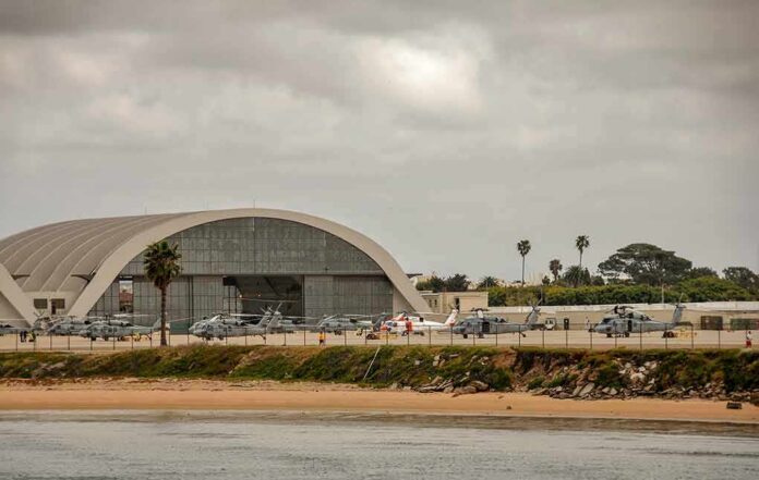 shutterstock_1086141389 airport hangar with helicopters near a shoreline