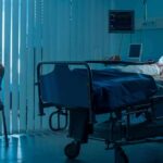 Dad Torches Dems After Daughter’s Death hospital room with child in bed and adult sitting nearby