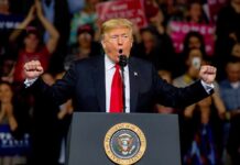 Team USA Captain Gives Trump the Credit Donald Trump speaking at a rally podium with arms raised