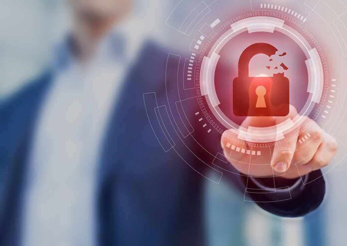 Hand touching holographic broken padlock icon