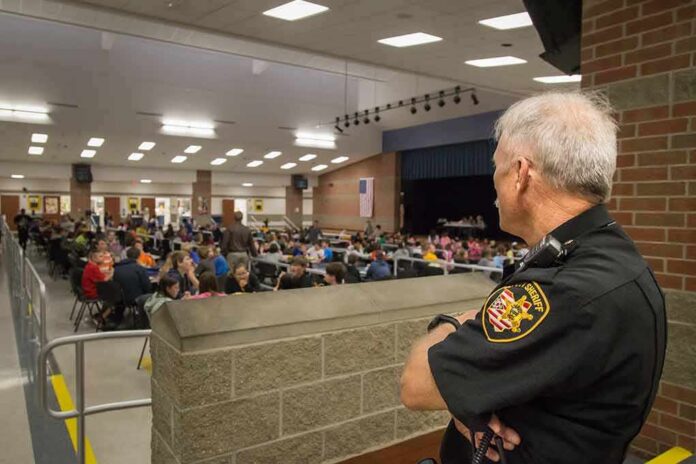 shutterstock_1231697209 security officer overseeing a crowded school cafeteria