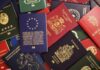 Assorted international passports spread out on a surface