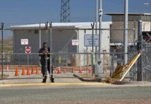 Major Civilian BREACH at Highly Secured U.S. Air Force Base Security guard at chain-link gate of fenced facility
