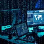 cybersecurity analysts at workstations with code and world map on screens