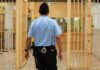 Cop Who Killed Sonya Massey DIES in Prison at 32 corrections officer walking through prison corridor