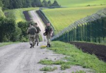 Hybrid Warfare Hits Finland’s Border Soldiers patrolling along a rural border fence